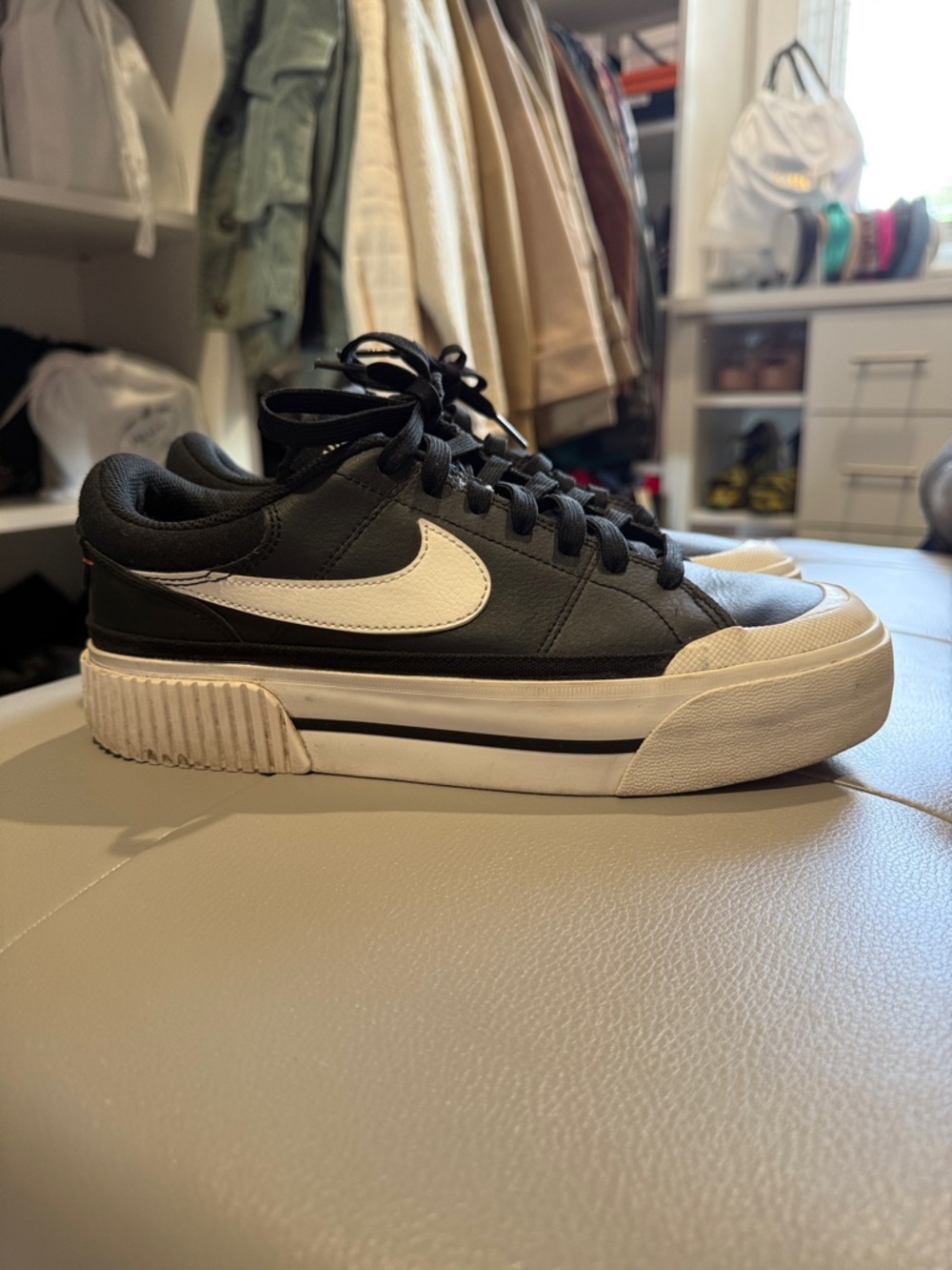 Nike women’s  Black Leather Low-Top Sneakers with White Swoosh and Cream Sole